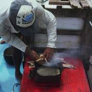 Making fish stew on a sailing jangada.